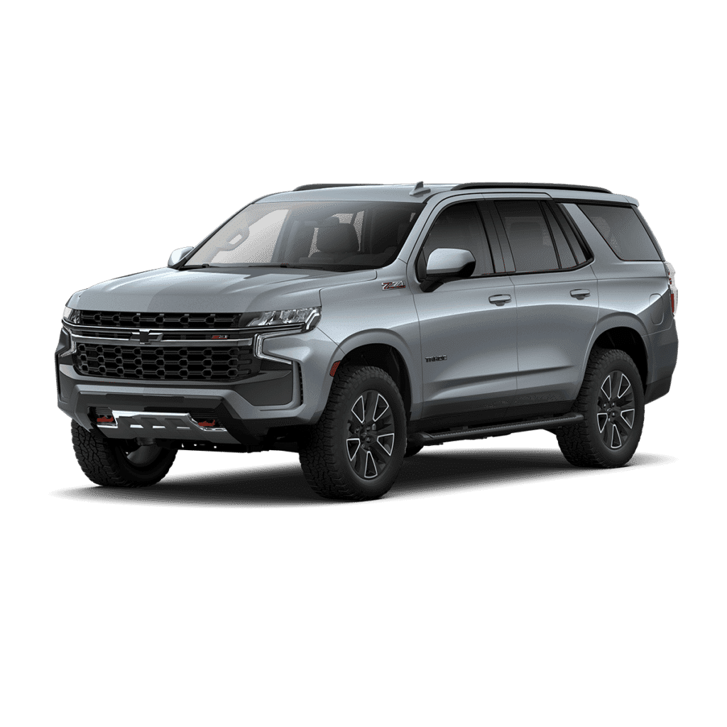 2023 Chevrolet Tahoe Z71 in silver, showcasing a rugged design with high ground clearance and off-road capabilities, ideal for families and adventure seekers.